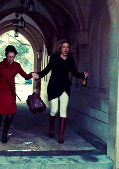 Cosima and Delphine run through the campus holding hands