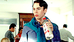 Felix drinks from a bottle of vodka