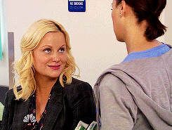 Ann and Ben stare at Leslie as she sits still