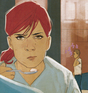 Natasha looking fed up with a spoon halfway to her mouth.