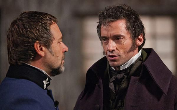 Jean Valjean and Javert look at each other
