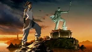 Korra poses beside the giant statue of Aang