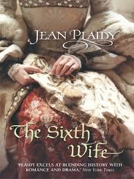 a book cover shows a woman wearing Tudor dress, you can only see her lap and hands - she is sewing
