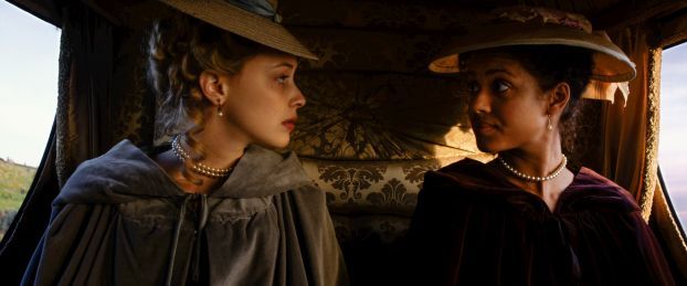 Elizabeth and Dido sit in a carriage and stare at each other