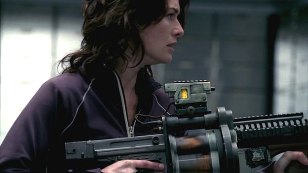 Sarah Connor brandishing a nuclear weapon & wearing a purple tracksuit top