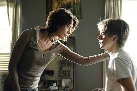 Sarah looks straight into John's eyes while laying a hand on his shoulder