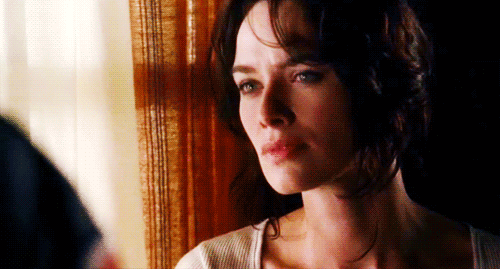 A complicated expression plays across Lena Headey's face