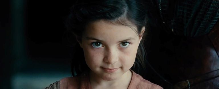 A very young Diana wears a determined look on her face