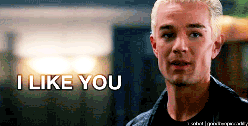 Spike from Buffy bites his lip while white tag line says I like you