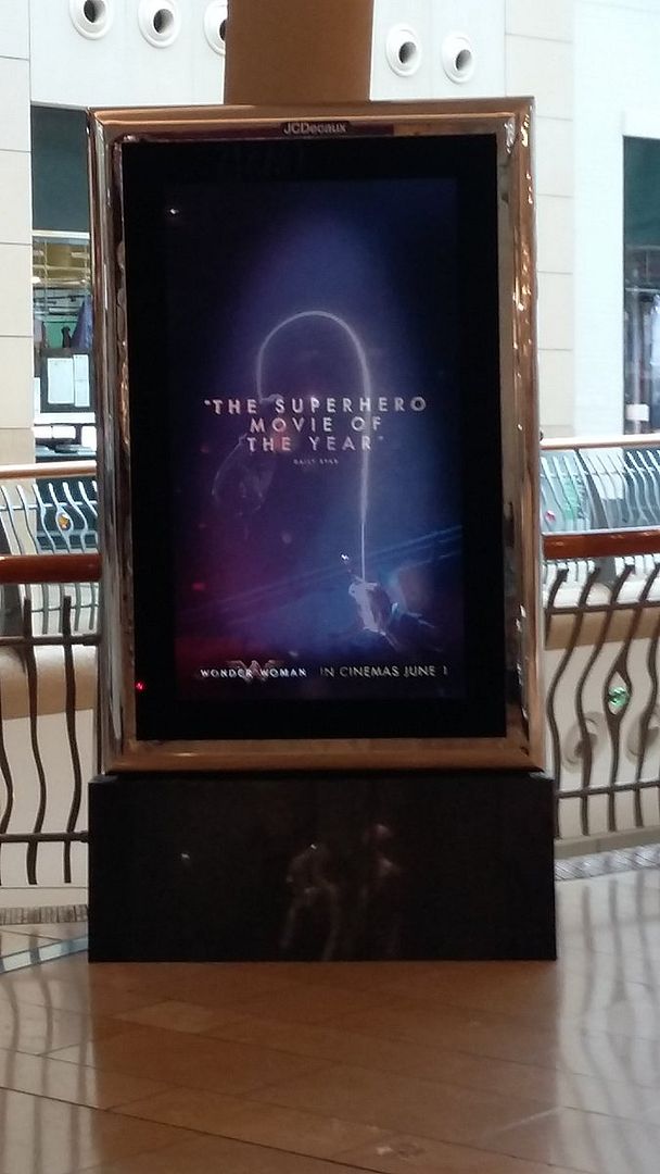 video stand showing Wonder Woman advert