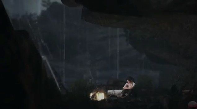 Lara sitting alone by a campfire
